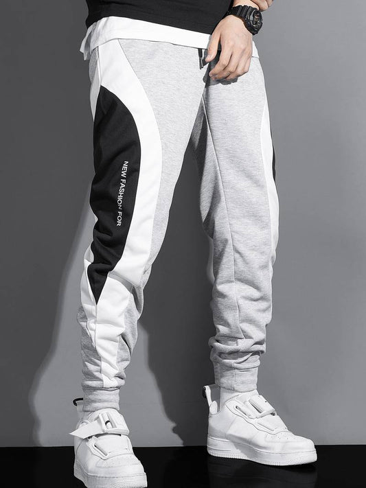 Herr sweatpants med dragsko – trendiga joggingsbyxor med sidopaneler och fickor